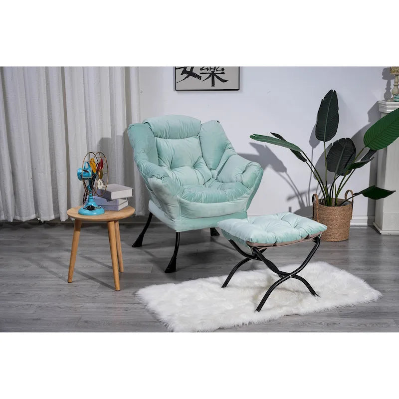 Fauteuil capitonné vert avec poche latérale