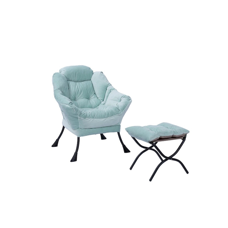 Fauteuil capitonné vert avec poche latérale