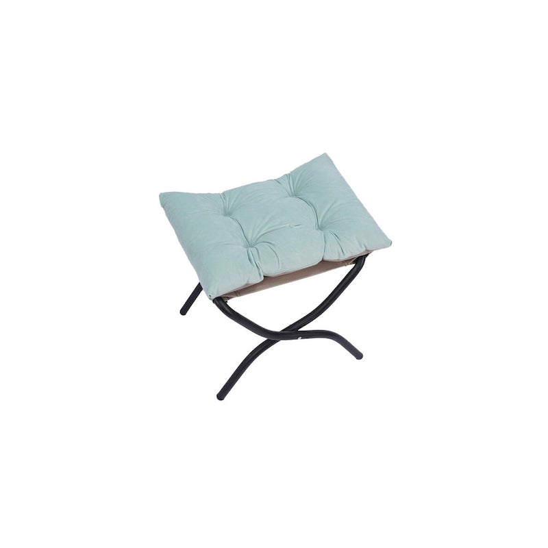 Fauteuil capitonné vert avec poche latérale