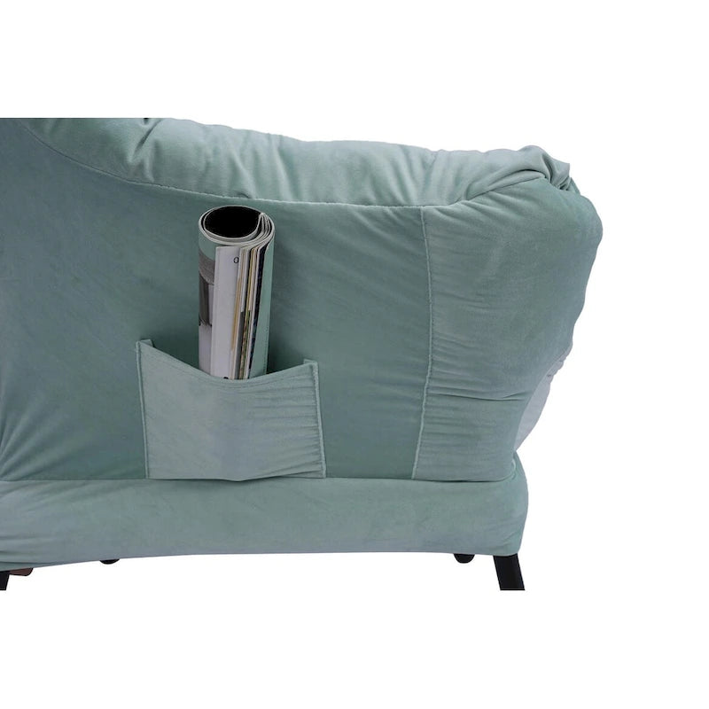 Fauteuil capitonné vert avec poche latérale
