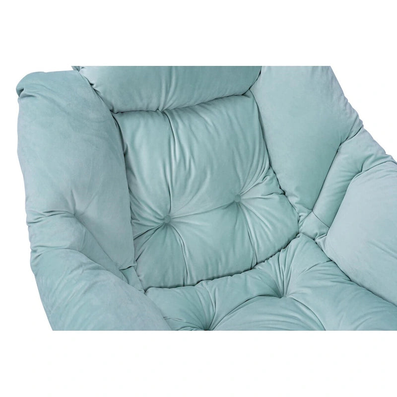 Fauteuil capitonné vert avec poche latérale
