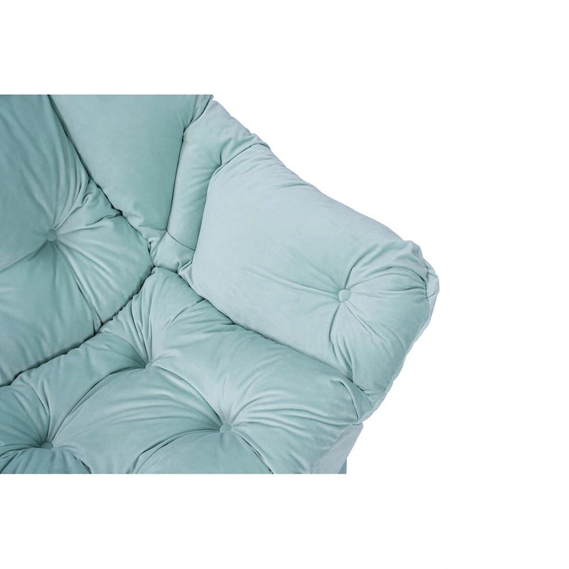 Fauteuil capitonné vert avec poche latérale