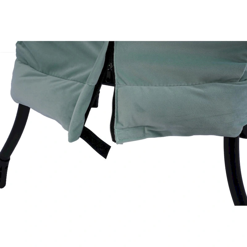 Fauteuil capitonné vert avec poche latérale